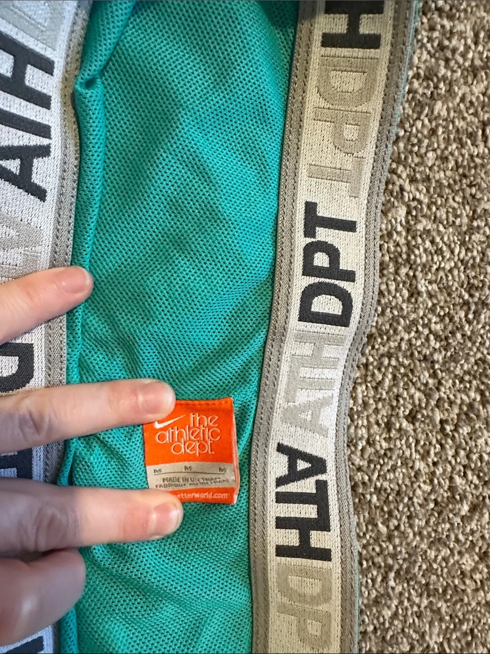 Nike Teal Running Shorts with Yellow Accent